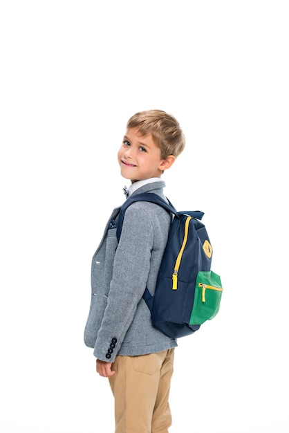 Smiling schoolboy with backpack isolated on white