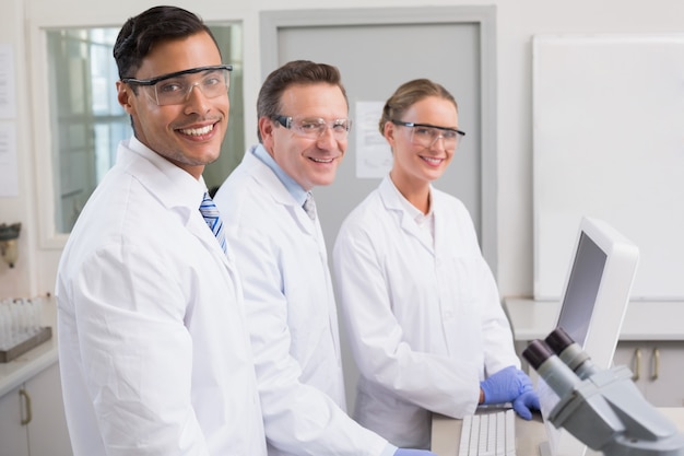 Smiling scientists looking at camera 