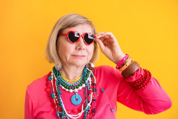 Smiling senior woman having fun in stylish clothes concepts about senior people