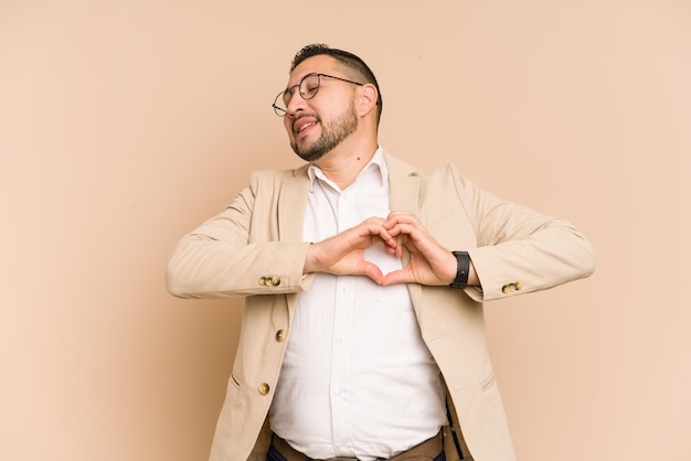 Smiling and showing a heart shape with hands