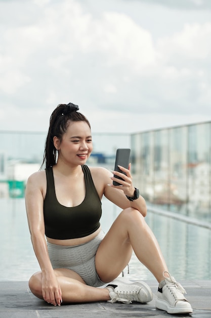 Smiling Sportswoman Taking Selfie