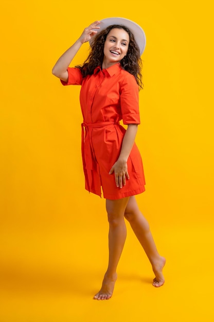 Smiling stylish summer woman on background photo of stylish summer woman wearing hat