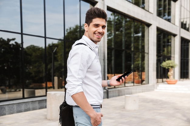 Smiling successful young businessman