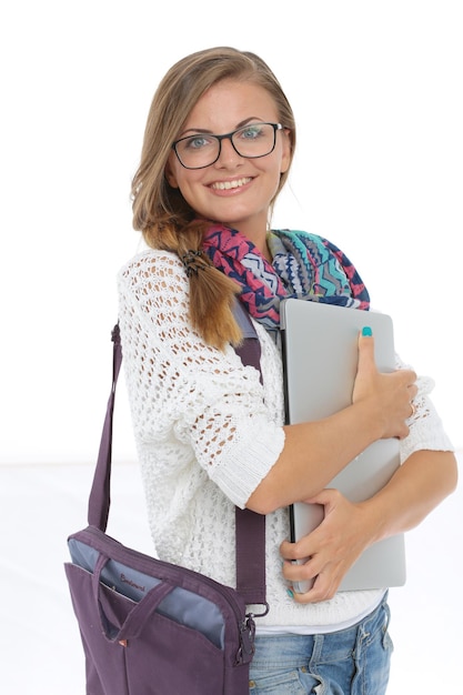 Smiling teenager with laptop on white background Student