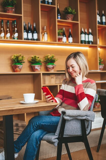 Smiling woman chatting with mobile phone