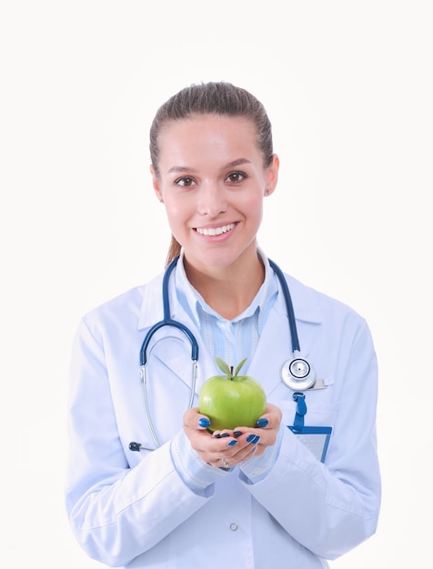 Smiling woman doctor with a green apple Woman doctor