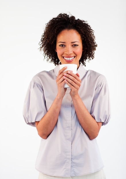 Smiling woman drinking a cup of coffee