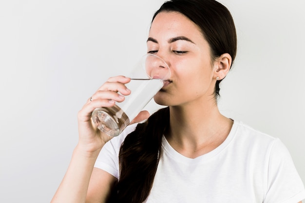 Smiling woman drinking water