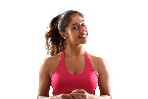 Smiling woman at the gym ready to start fitness lesson