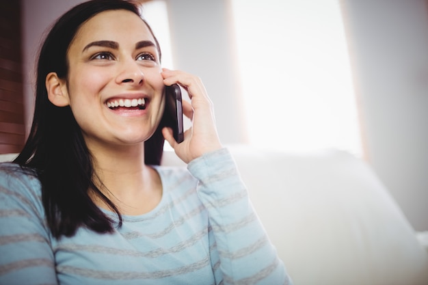 Smiling woman talking on phone