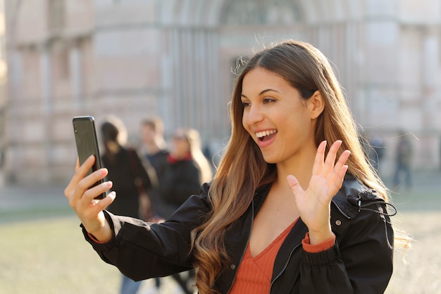 Smiling woman using her smartphone