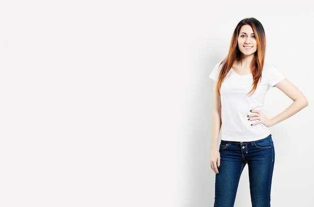 Smiling Woman Wearing White T-Shirt on Background