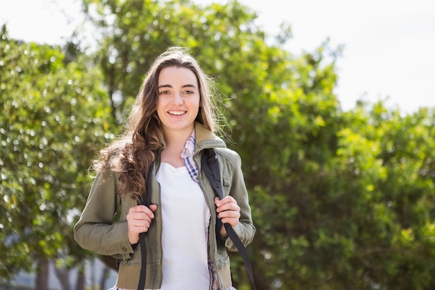 Smiling woman with backpack