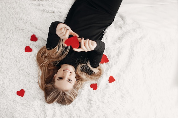 smiling woman with hearts indoor