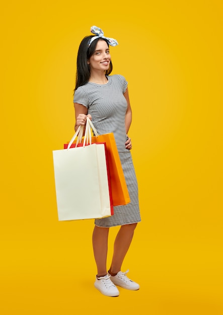 Smiling woman with paper bags