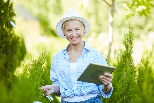 Smiling Woman Working at Plantation