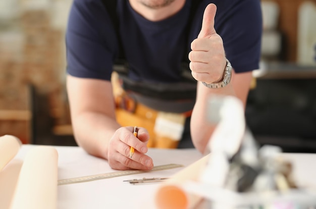 Smiling worker in yellow helmet