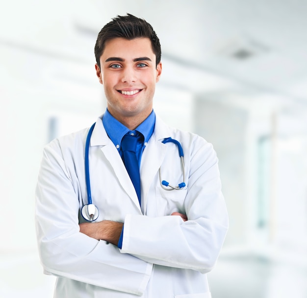 Smiling young doctor at the hospital