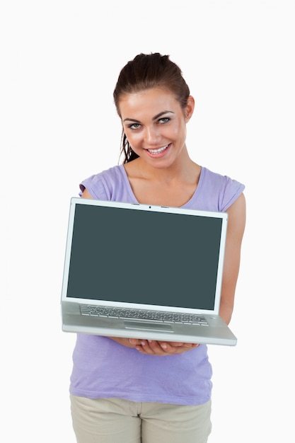 Smiling young female with her laptop