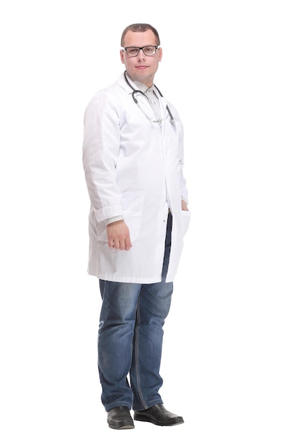 Smiling young male doctor with stethoscope over neck in medical coat