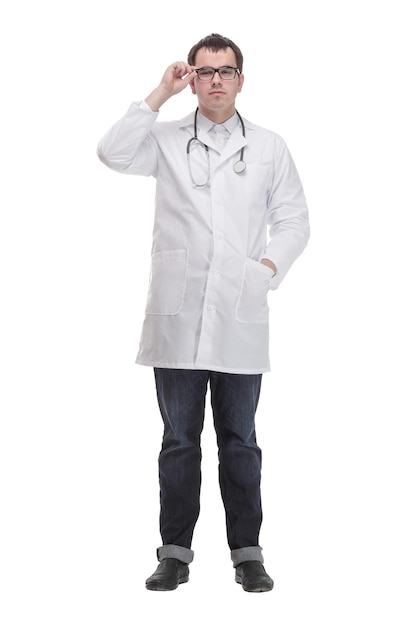 Smiling young male doctor with stethoscope over neck in medical coat