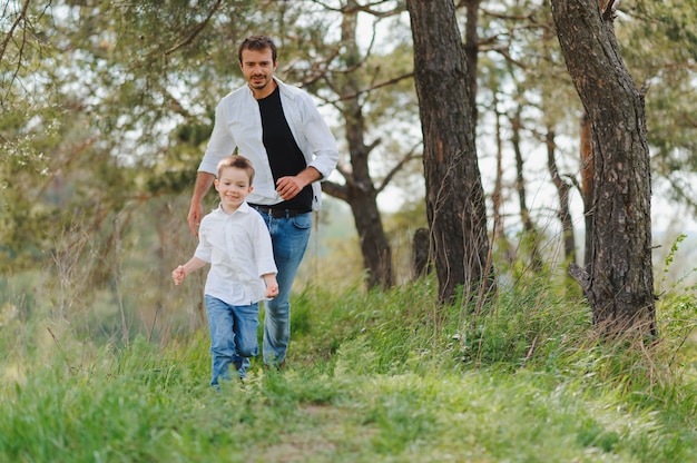 Smiling young man spending time together with his son