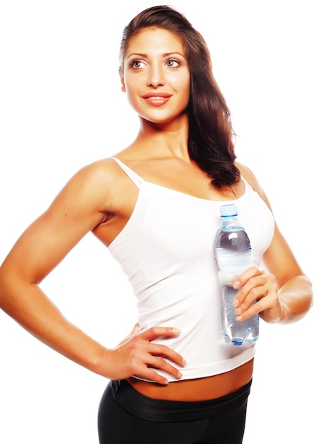 Smiling young sporty woman with water