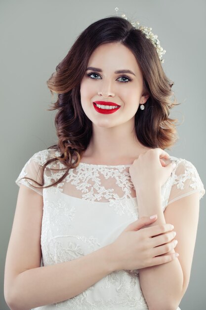 Smiling young woman bride with makeup and bridal haircut Pretty woman with cute smile