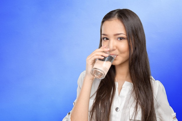 Smiling Young Woman with glass of Water