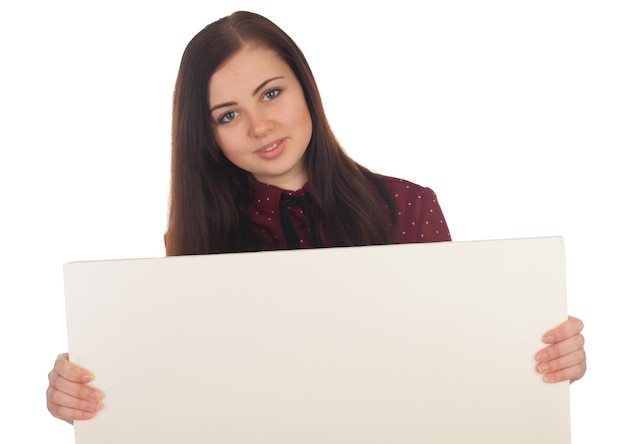 Smilling woman is holding in her hands a white canvas