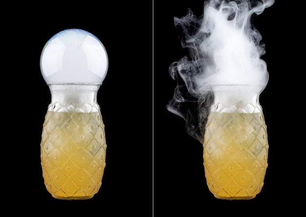 Smoke bubble lemon cocktail on black background Before and after bubble burst Isolated