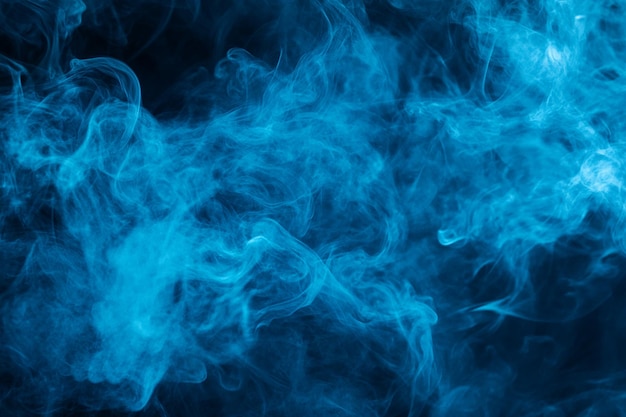 Photo smoke in a dark background the blue smoke is from the series by person