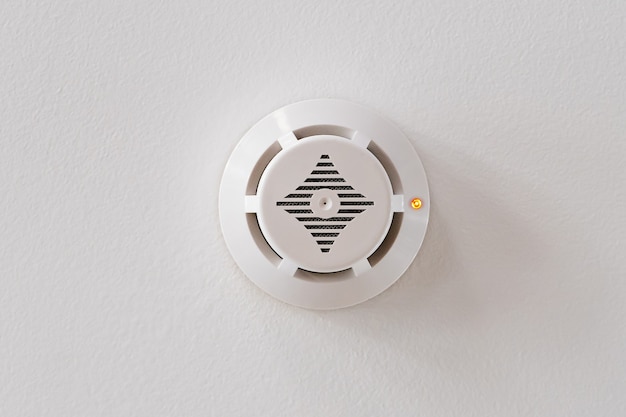 Smoke detector on the white ceiling. fire alarm.