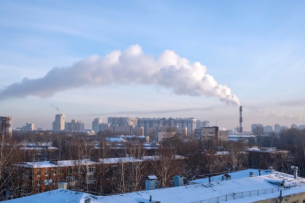 Smoke from chimney above a residential area of the city.