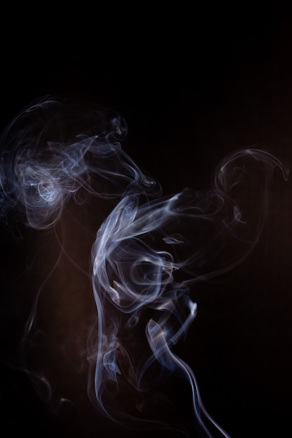 Smoke motion on black background.