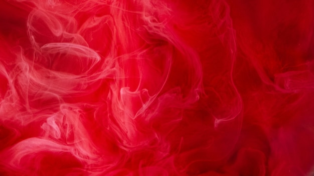 Smoke swirl paint water blend defocused red color dust particles texture steam floating spreading