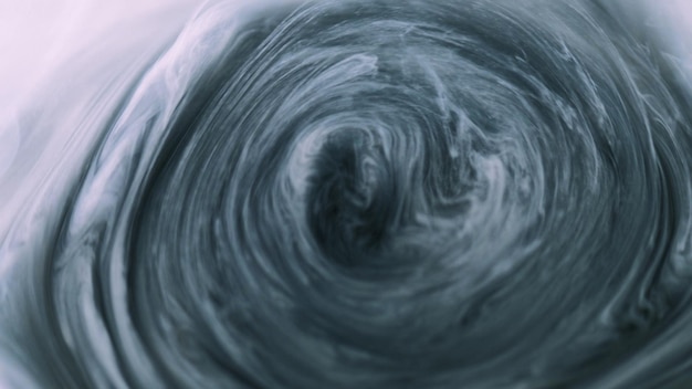 Smoke vortex underwater paint defocused white black gray haze cloud ink water mix spiral motion silk