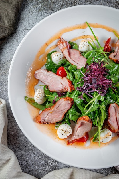 Smoked duck breast salad with vegetables and spices