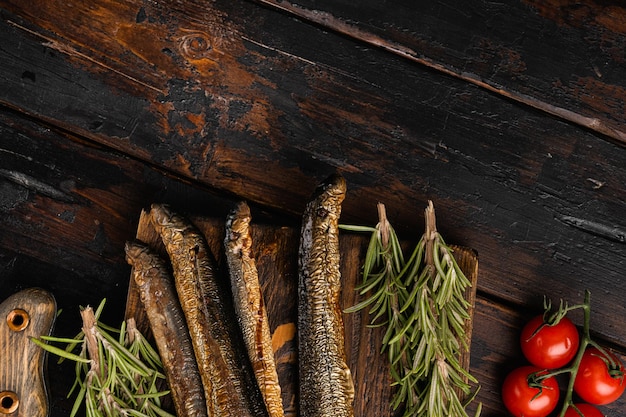 Smoked Lamprey  seafood delicacy set, on old dark  wooden table background, top view flat lay, with copy space for text