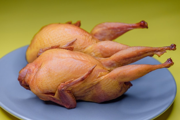 Smoked quail meat on a plate. A photo. poultry, quail, cooking