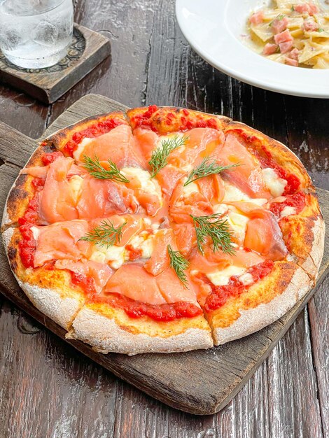 smoked salmon pizza on wood tray