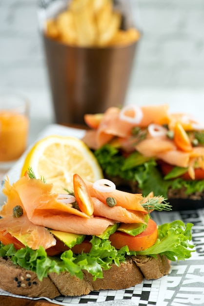 Smoked salmon and salad on a slice of toasted wholewheat bread, a light meal option