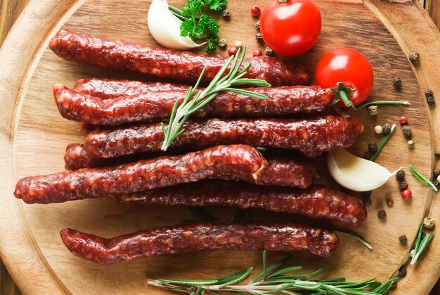 Smoked sausage with rosemary and peppercorns tomatoes and garlic