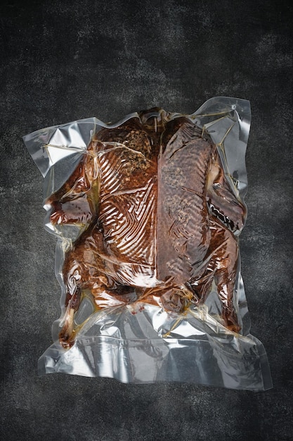 Smoked whole duck in a plastic bag vacuumed