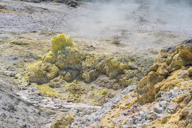 Smoking solfatara in a fumarole field on the slope of the Mendeleev volcano