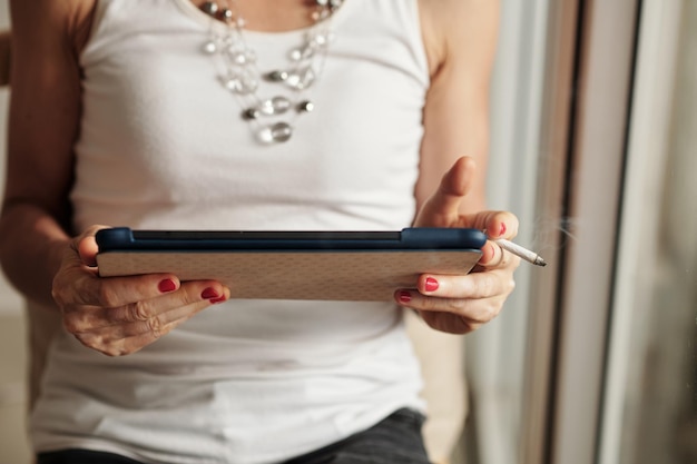 Smoking Woman Reading Article