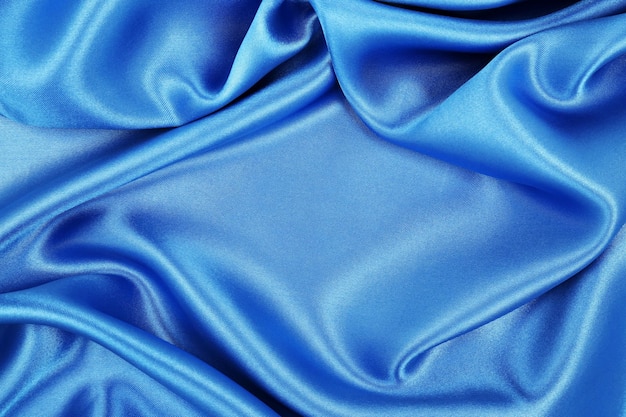 Smooth elegant blue silk or satin luxury cloth texture as abstract background