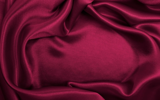 Smooth elegant pink silk or satin luxury cloth texture as abstract background