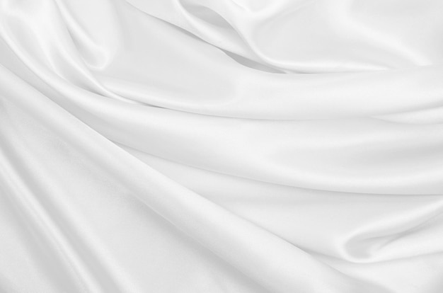 Smooth elegant white silk or satin luxury cloth texture as wedding background