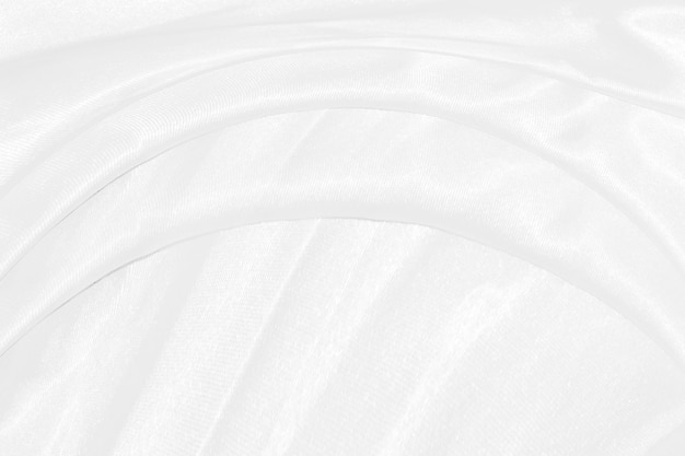 Smooth elegant white silk or satin luxury cloth texture can use as wedding background Luxurious background design